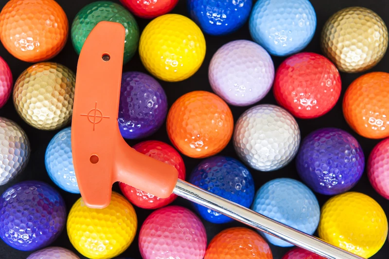 orange putt putt club with balls