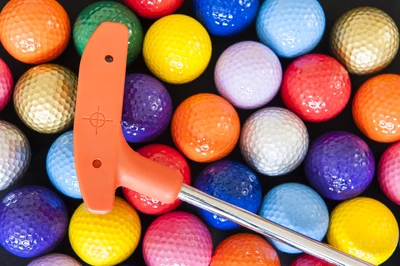 orange putt putt club with balls